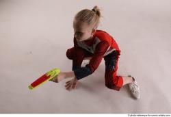 DENISA SITTING POSE WITH GUN